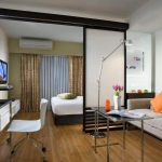 Design della camera da letto e del soggiorno in una stanza