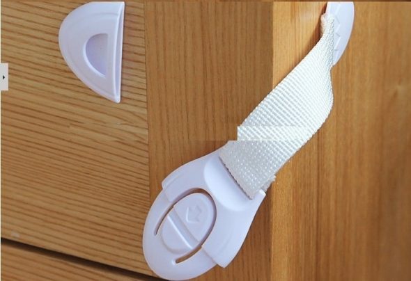 Protezione per bambini per cassetti e armadi