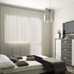 Interno di una piccola camera da letto per adulti, decorata con toni rilassanti
