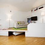 Podio con mobili integrati e letto estraibile