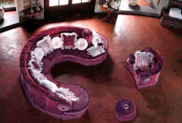Un elegante divano rotondo trasformabile che si trasforma in poltrona, divano grande e pouf.