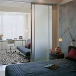 La suddivisione in zone della camera da letto e del soggiorno può