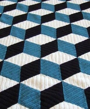 Coperta con motivo voluminoso