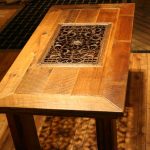 Tavolo in legno con traliccio forgiato al centro