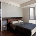 Piccola camera da letto dalla forma irregolare in stile minimalista