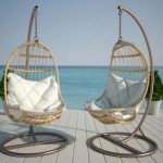 Poltrona sospesa in rattan con cuscini