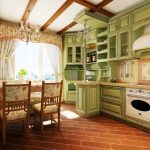 Bellissima cucina verde con alti soppalchi
