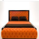 Letto a forma di carrozza nei toni dell'arancione e del marrone