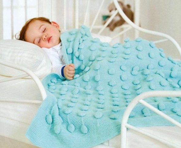 Coperta con motivo voluminoso
