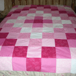 Coperta patchwork nei toni del rosa