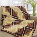Coperta per divano realizzata in filato multicolore