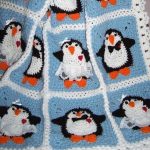 Coperta con pinguini da frammenti lavorati a maglia separati