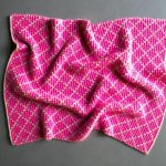 Coperta con motivo geometrico jacquard