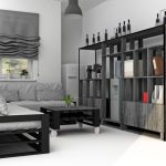 Un divano e un tavolo grigio-nero rigorosi realizzati con materiali di scarto