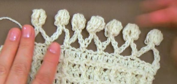 Rifinire il bordo con pompon