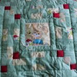 Delicata coperta patchwork per neonato
