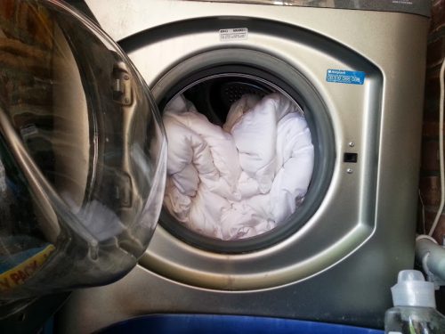 Mettere la coperta nel cestello