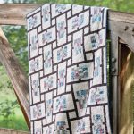 Copriletto rettangolare con inserti patchwork neri