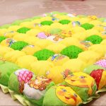 Coperta luminosa e soleggiata per la culla e per i giochi del bambino
