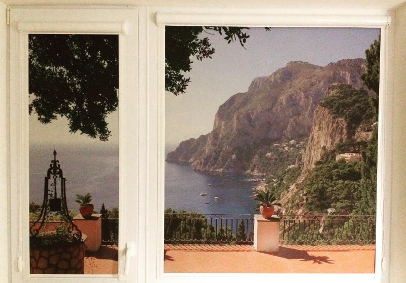 Spiaggia con tende a rullo e stampa fotografica