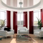 Tende da soffitto color borgogna per grandi finestre in una stanza ovale
