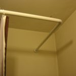 Bastone per tenda in plastica a forma di L per il bagno