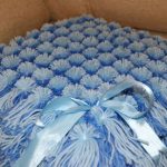 Una copertina blu per neonato è adatta per la dimissione e per una passeggiata