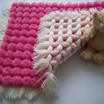 Coperta fai da te con piccoli pompon