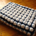 Coperta con pompon Fiocchi di neve