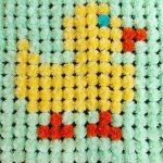 Coperta con pompon e paperella