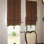 Tende romane a righe con nappe