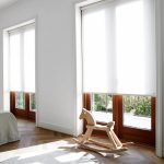 Tende a rullo bianche in materiale traslucido
