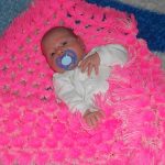 Coperta luminosa per il bambino nella culla