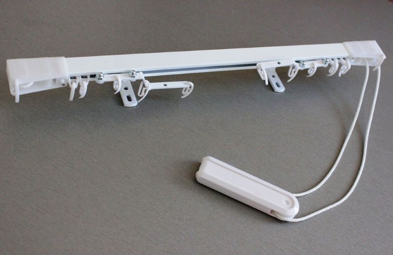 Bastone per tende da parete con comando manuale