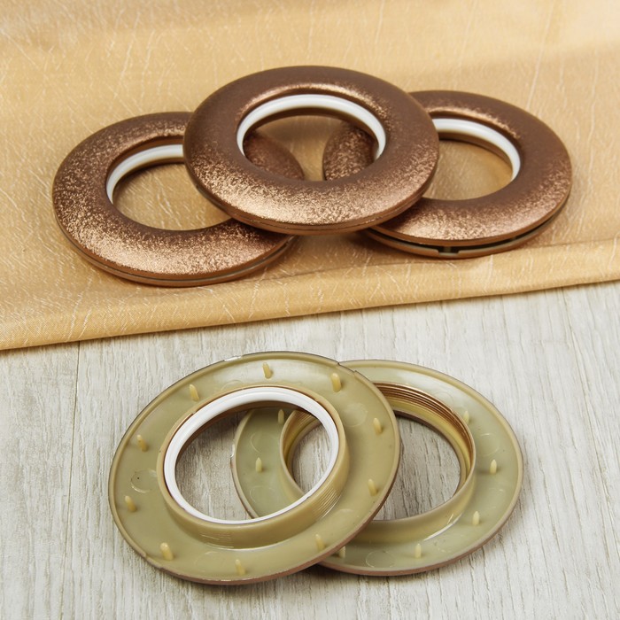 Occhielli per tende in plastica con rivestimento in rame