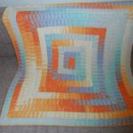 Coperta per divano o letto realizzata con la tecnica dei 10 anelli