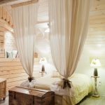 suddivisione in zone della stanza con design delle tende
