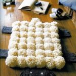 decorazione del tappeto con pompon
