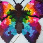 tappeto a farfalla con pompon
