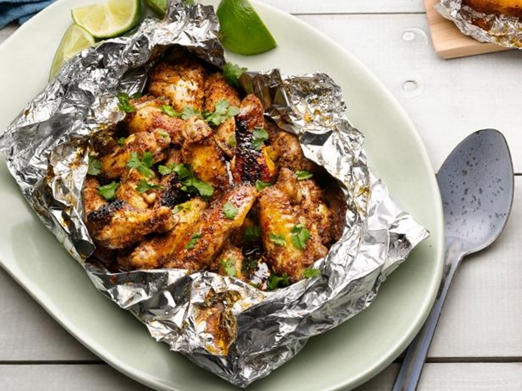 cosce di pollo in carta stagnola per la cottura al forno